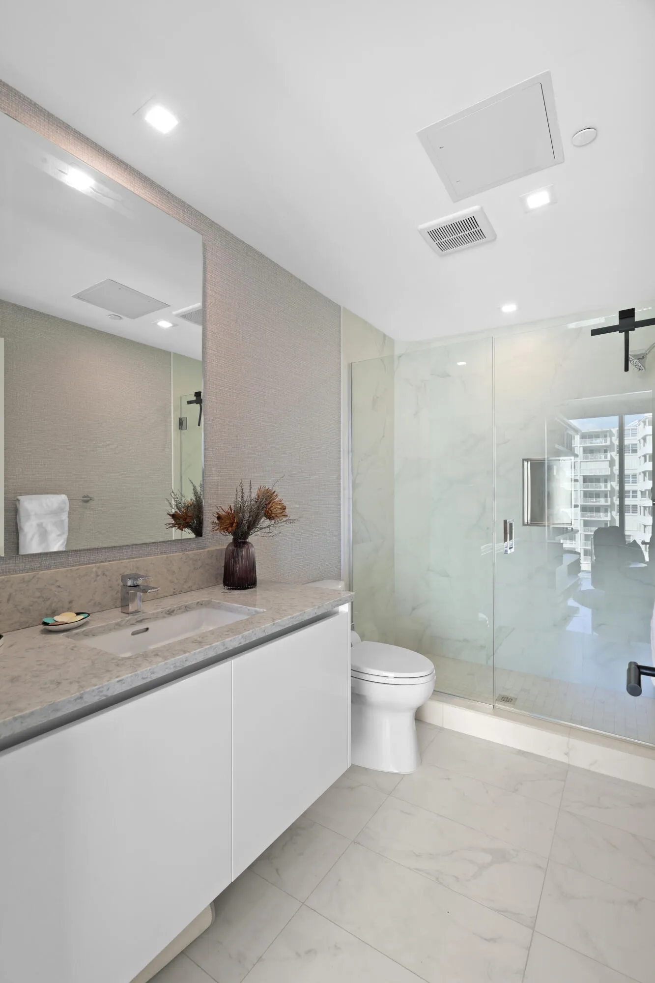 Guest bedroom 2 features more designer touches, automated blinds, customized closet, murphy bed and ensuite bathroom.