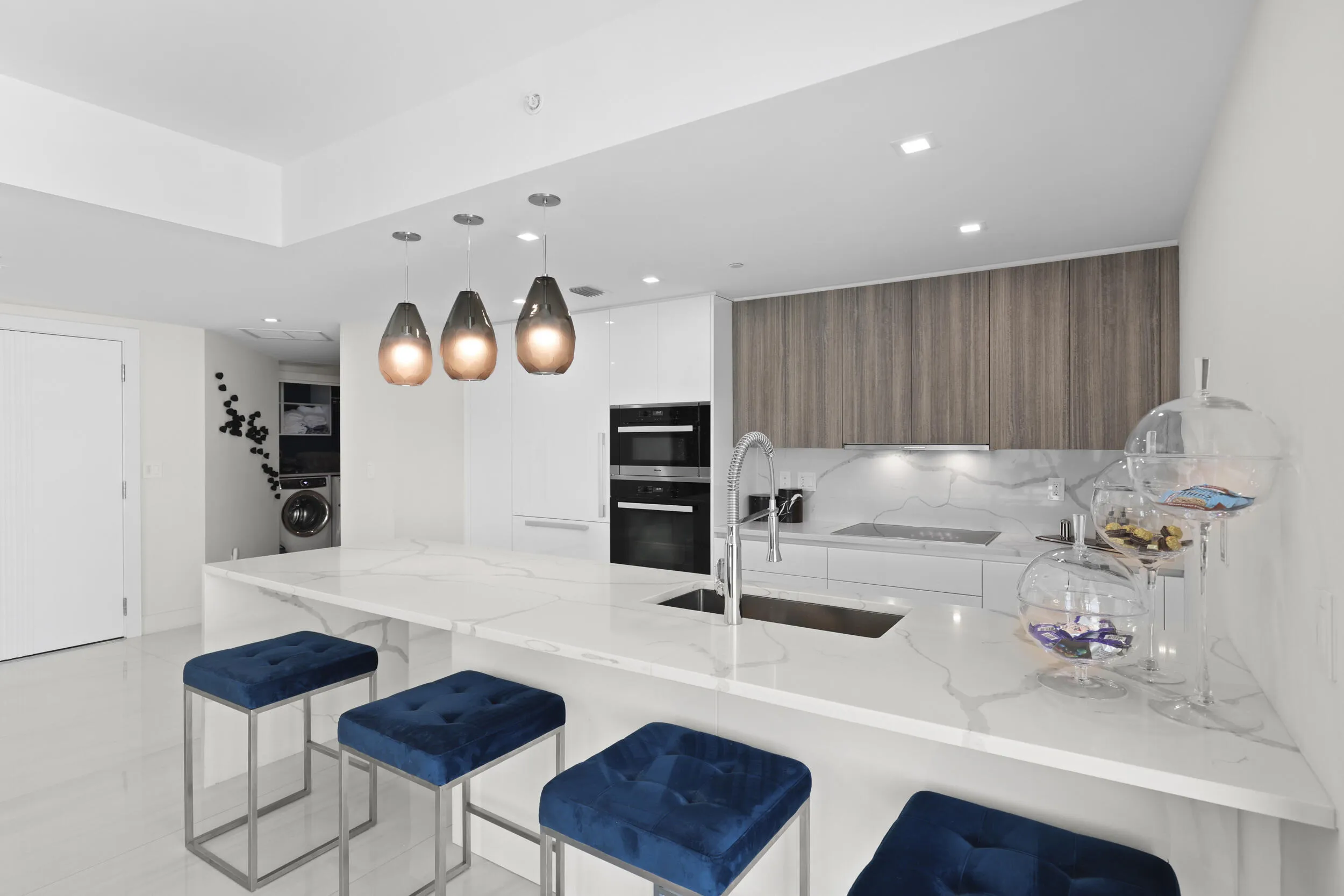 Beyond the chef's kitchen lie 2 guest bedrooms, 3 full bathrooms and a den with style that is rarely seen.