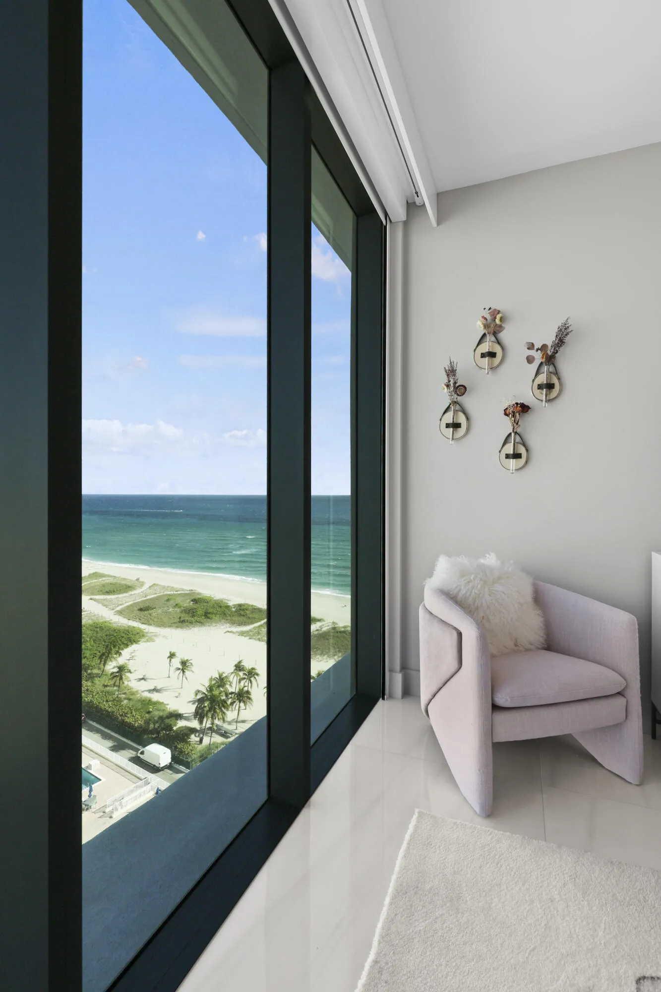 Guest bedroom 1 features more designer touches, automated shades & blinds, customized closet, and ensuite bathroom.