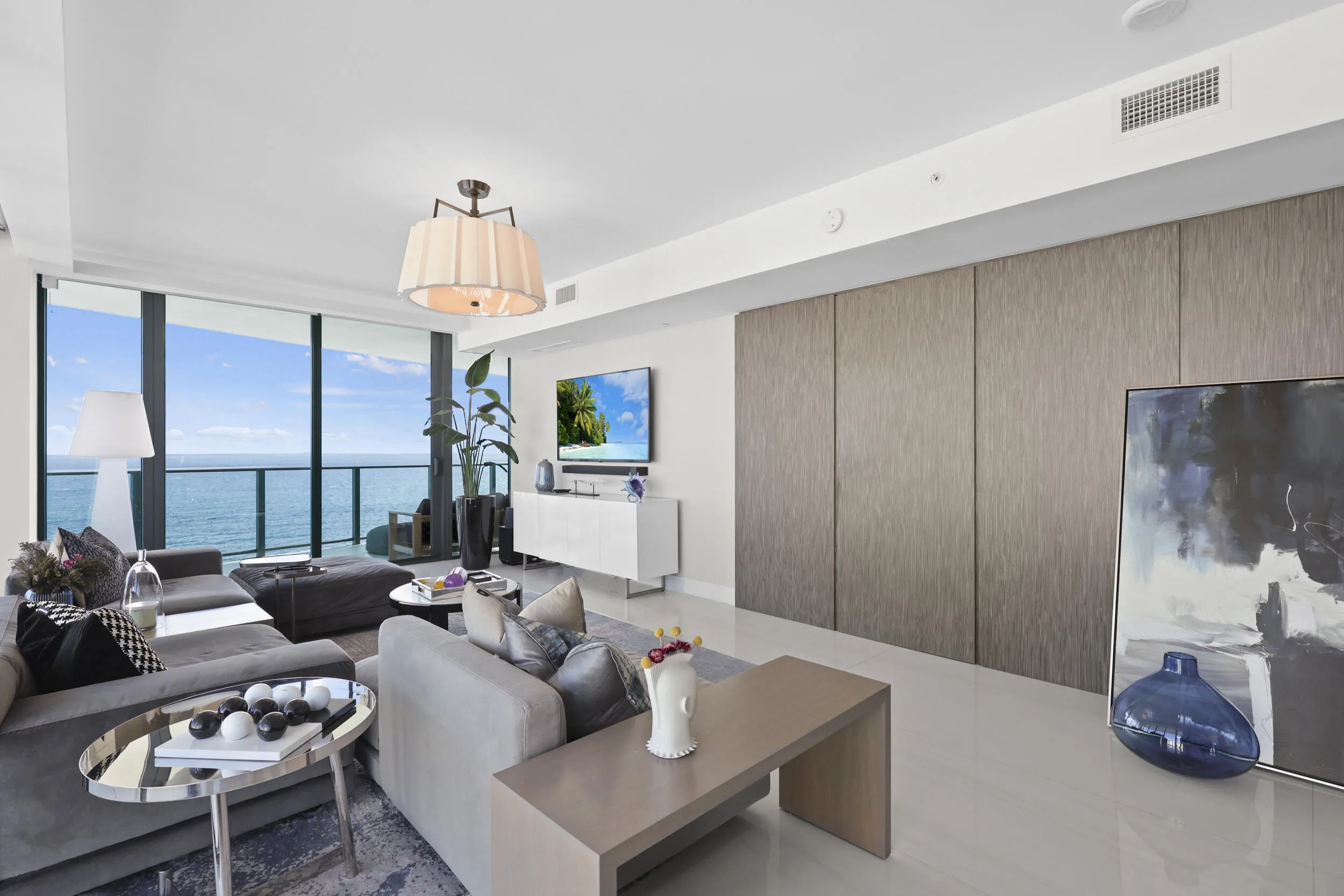 Beyond the custom concealed doors awaits a private oceanfront suite, where timeless elegance meets breathtaking Atlantic views.