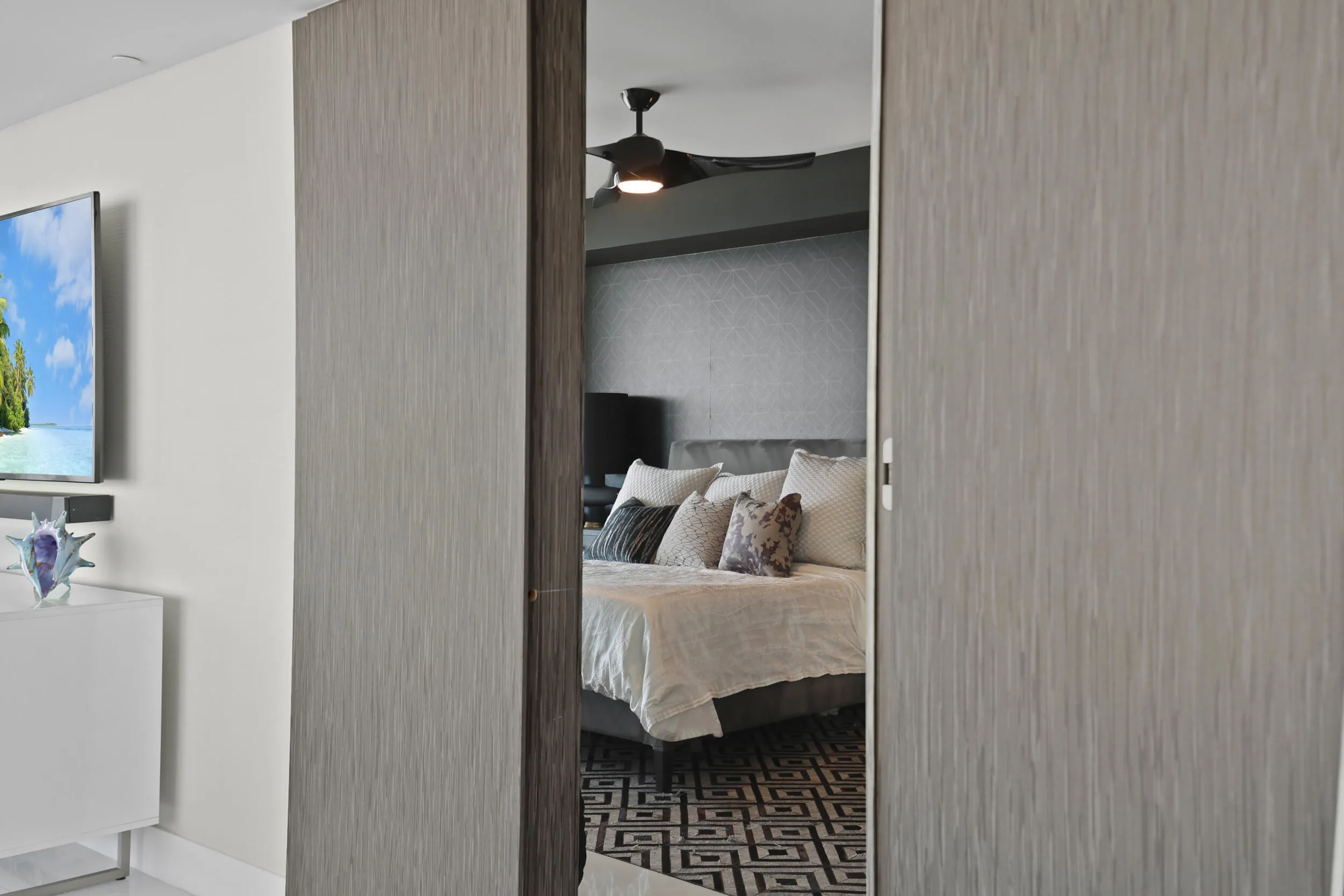 Through the custom designer door lies a private oceanfront suite with timeless elegance.