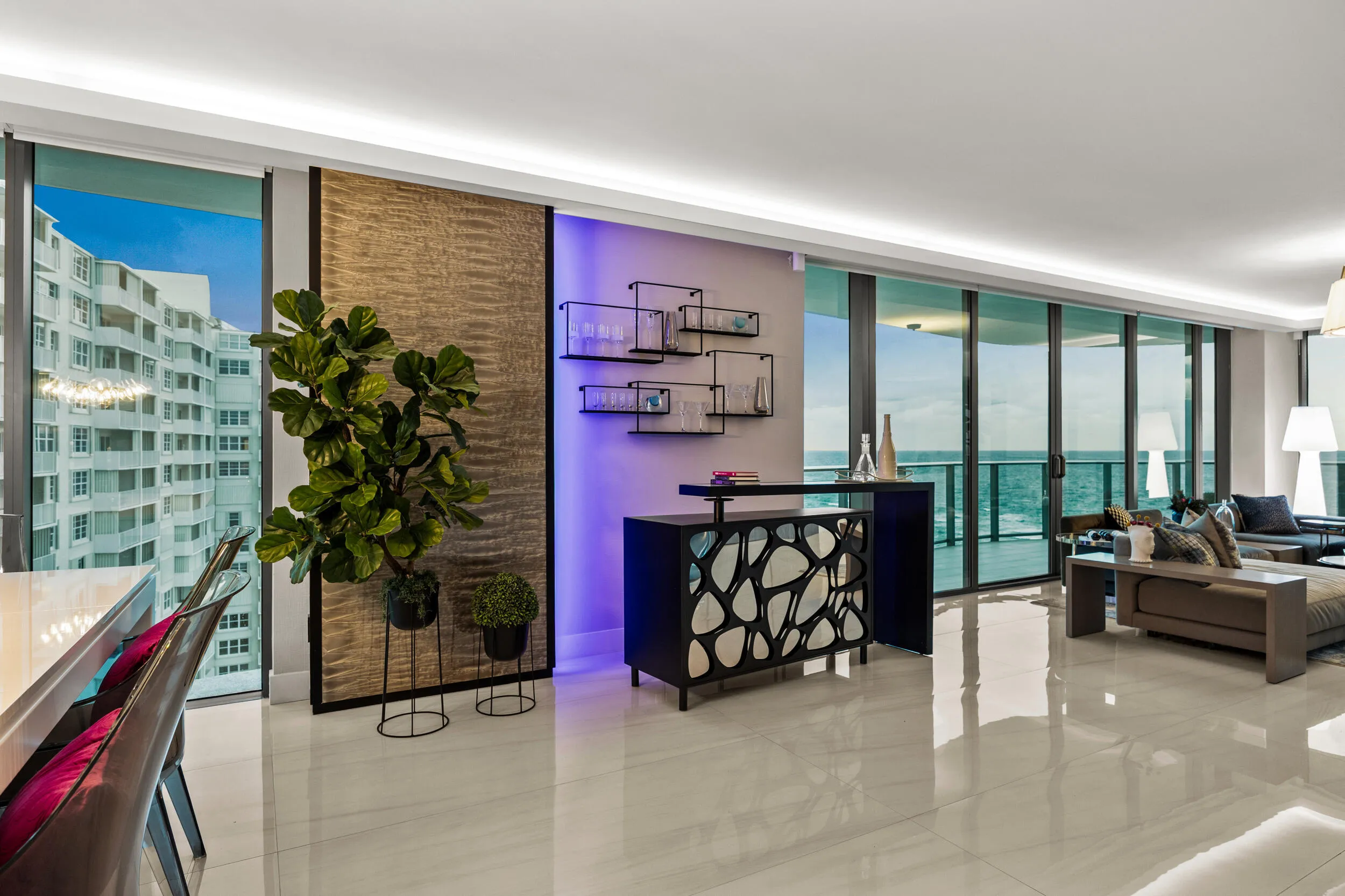 As the sun recedes into the night, the custom lighting comes alive showing why this is the most stylish condo in Pompano Beach.