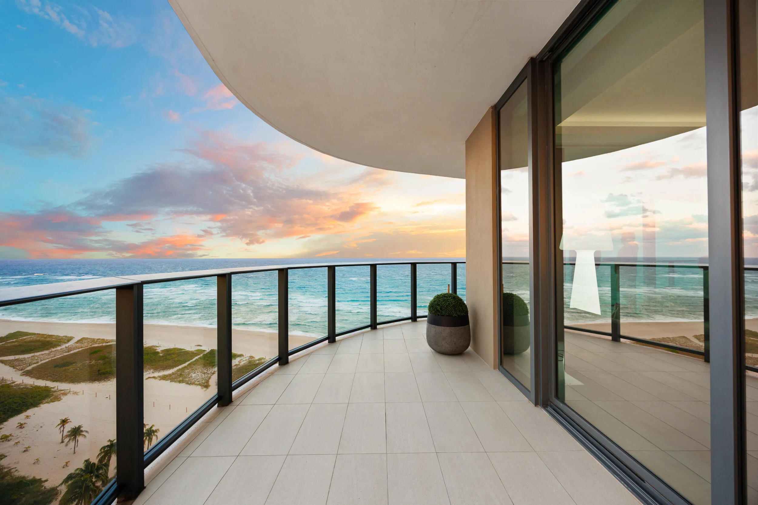 The expansive wraparound balcony offers an exceptional amount of outdoor living space and a peaceful setting to unwind with family and friends. As evening falls, enjoy colorful sunsets over the Intracoastal while the Atlantic fades into twilight and ocean breezes move gently through the air.