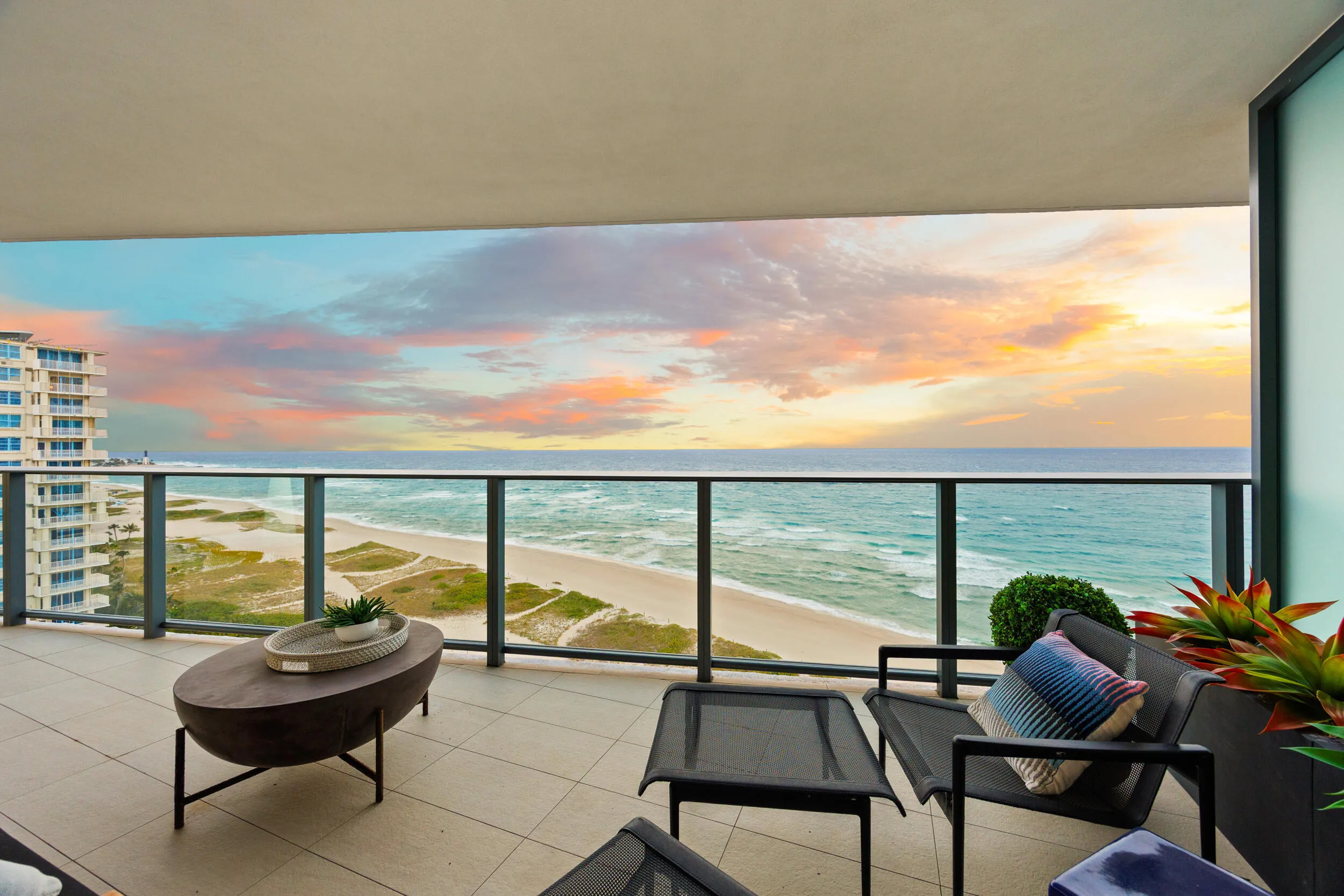 The expansive wraparound balcony offers an exceptional amount of outdoor living space and a peaceful setting to unwind with family and friends. As evening falls, enjoy colorful sunsets over the Intracoastal while the Atlantic fades into twilight and ocean breezes move gently through the air.