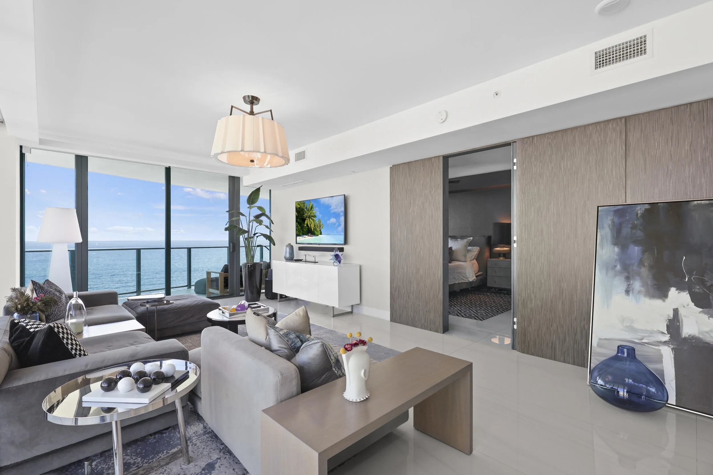 Beyond the custom concealed doors awaits a private oceanfront suite, where timeless elegance meets breathtaking Atlantic views.