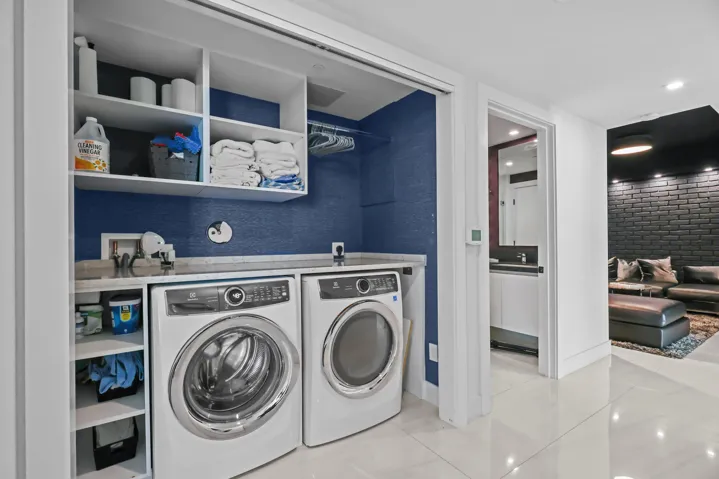 A full size laundry closet offers hidden functionality.