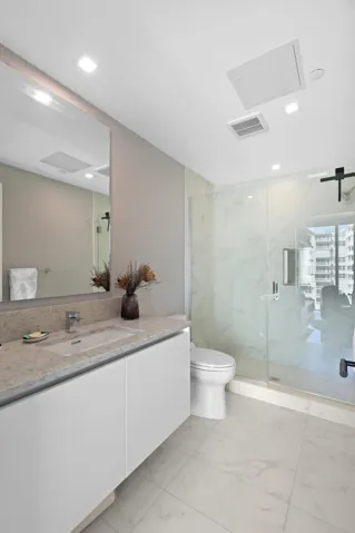 Guest bedroom 2 features more designer touches, automated blinds, customized closet, murphy bed and ensuite bathroom.
