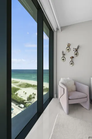 Guest bedroom 1 features more designer touches, automated shades & blinds, customized closet, and ensuite bathroom.