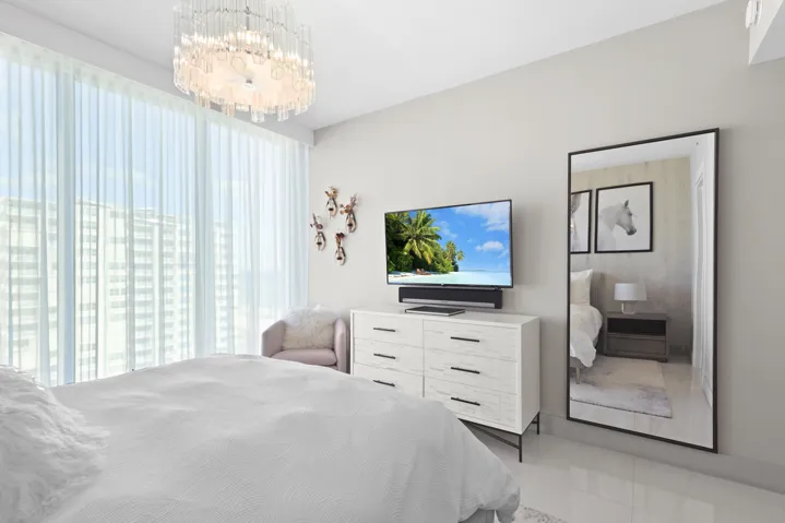 Guest bedroom 1 features more designer touches, automated shades & blinds, customized closet, and ensuite bathroom.