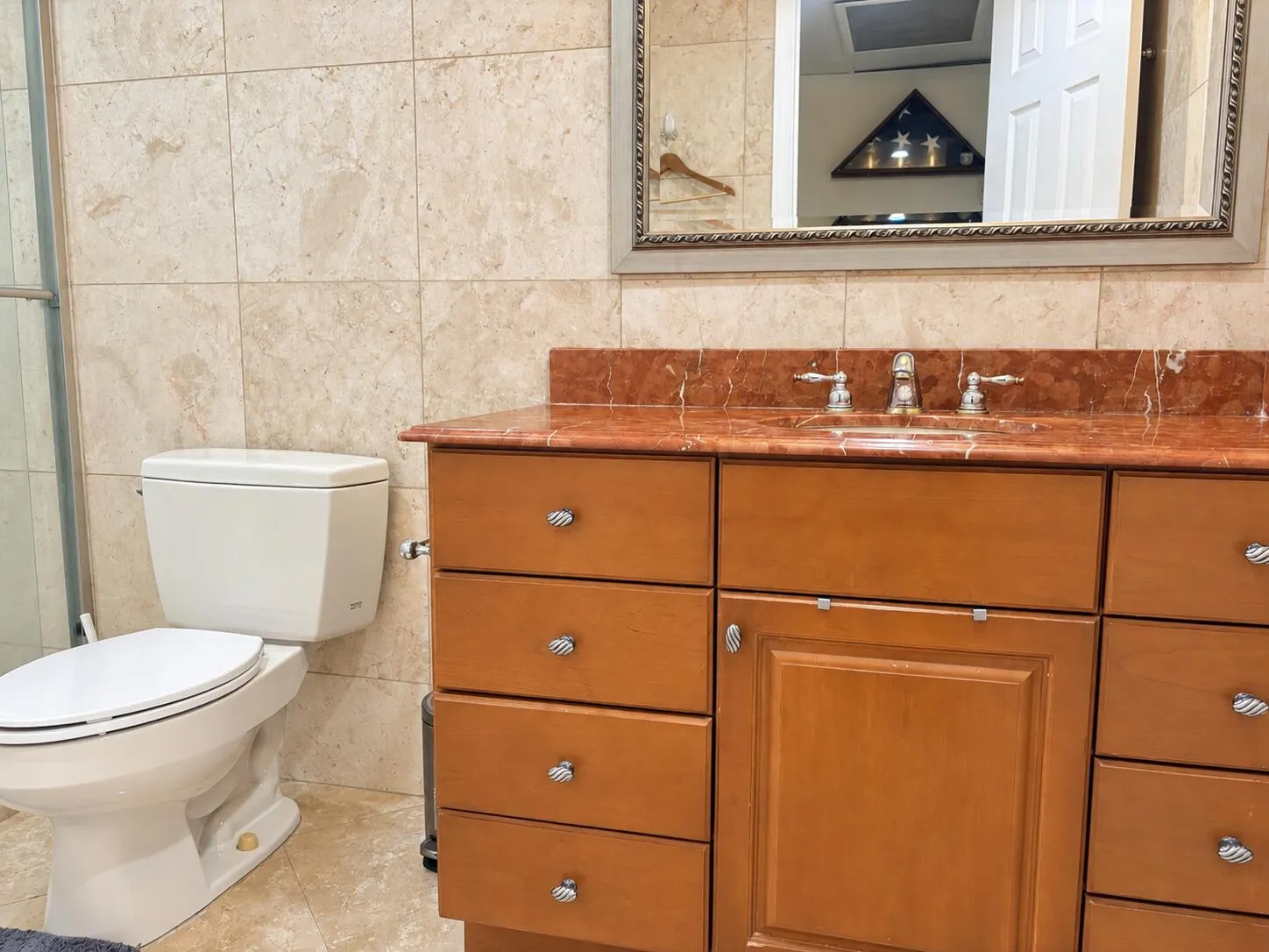 Remodeled bath with tile floor and walls