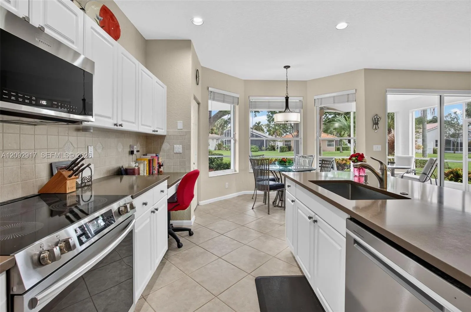 Updated kitchen with stainless appliances and quartz countertops.