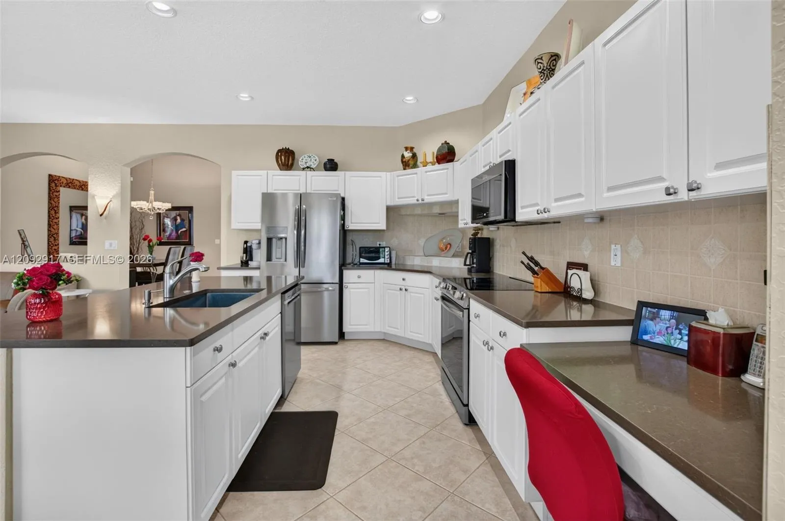 Updated kitchen with stainless appliances and quartz countertops.