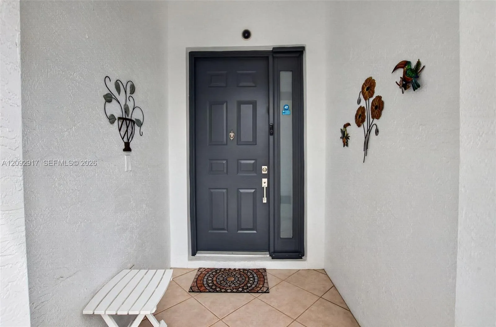 Front door in screened entry.