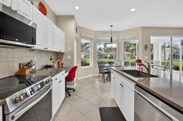 Updated kitchen with stainless appliances and quartz countertops.