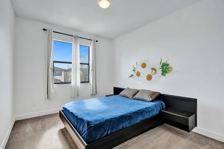 Double-pane window with dark trim, recessed ceiling light, and neutral wall color