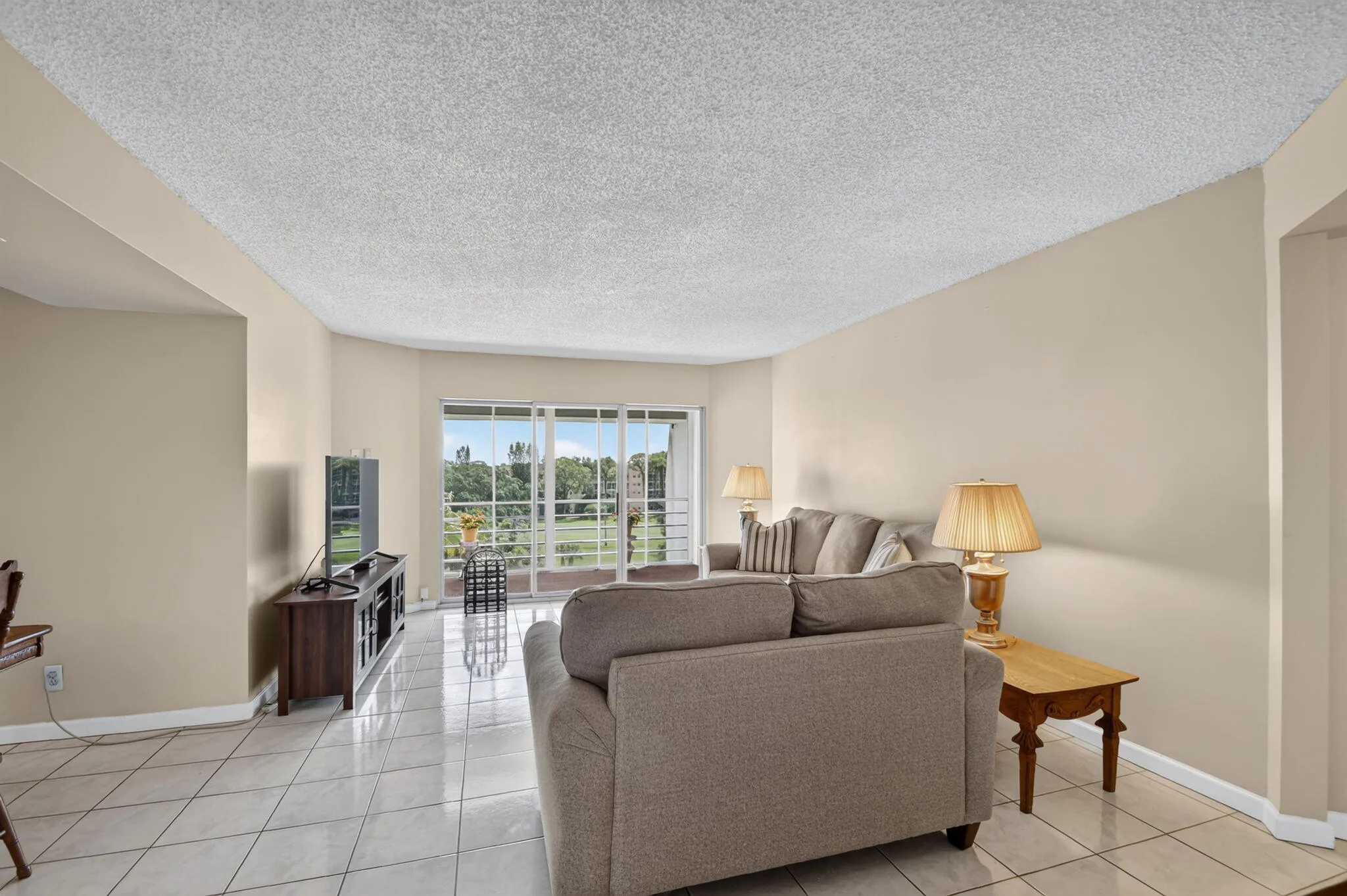 Living area with tile flooring and neutral wall tones