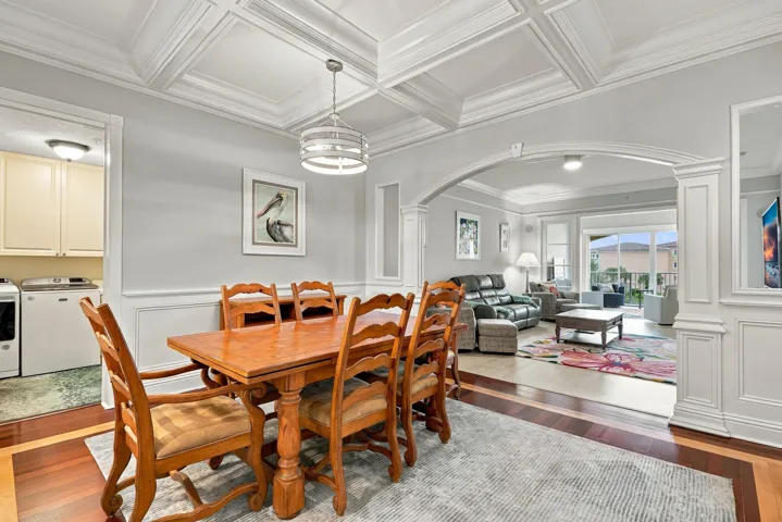 Archway gives nice separation between living and dining area