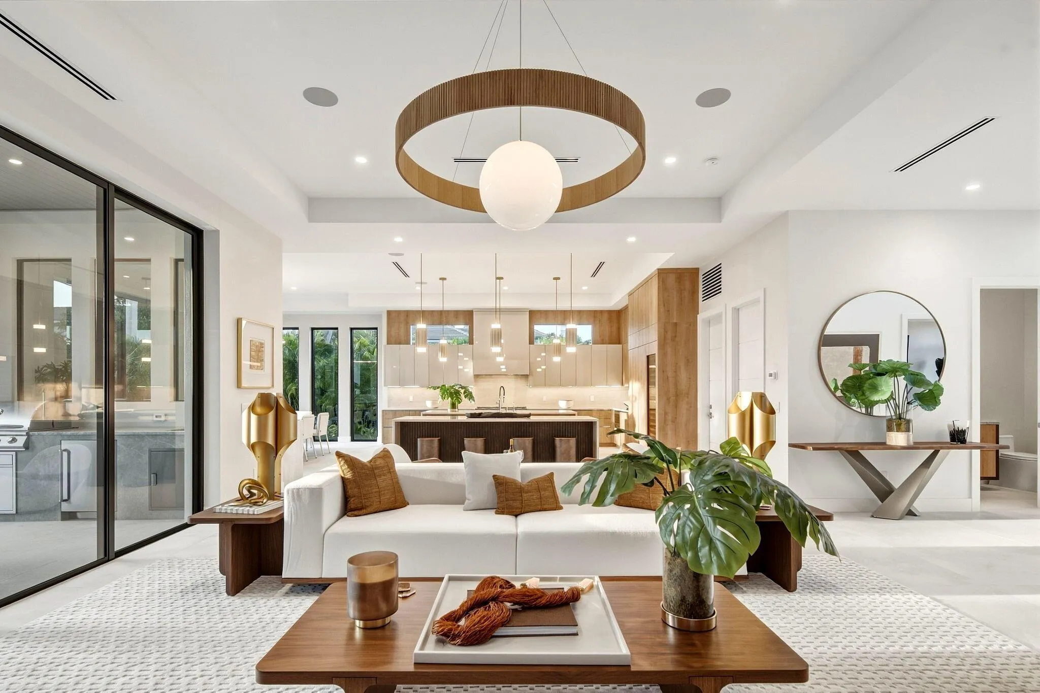 Recessed lighting, wood-finish flooring, and a contemporary circular chandelier