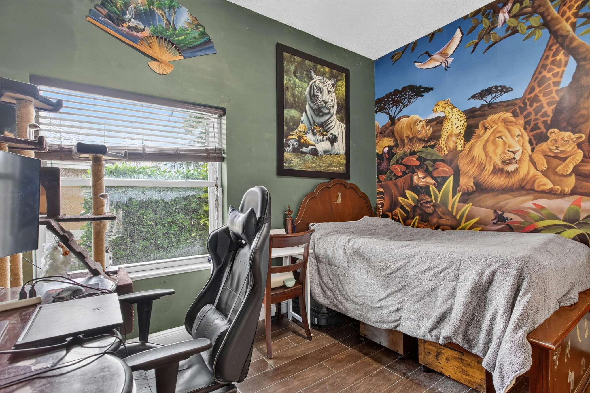 Fifth Bedroom. View from walk in closet looking towards the window and mural wall.