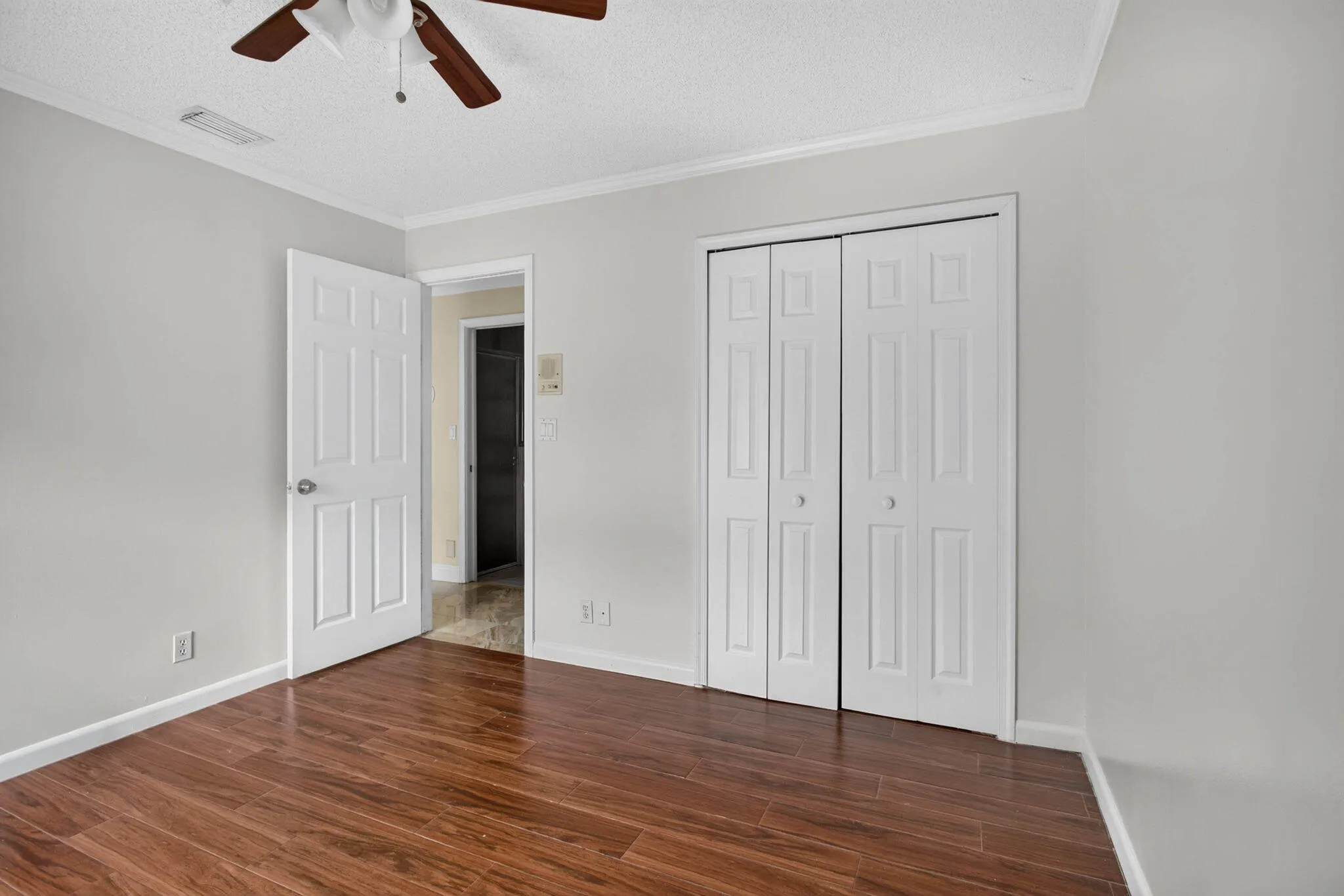 Second bedroom. Looking from window wall towards closte and entry door.