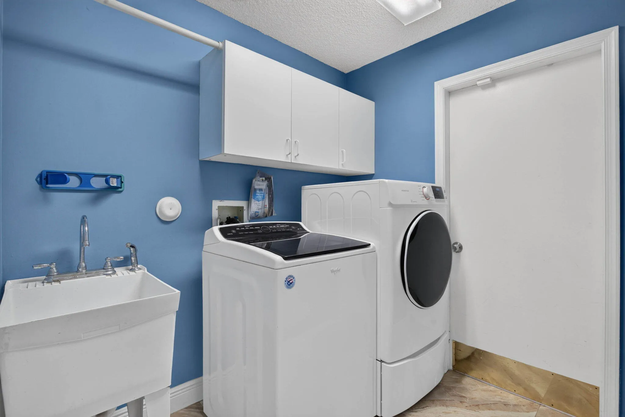 Laundry room. View looking towards the garage entrance.
