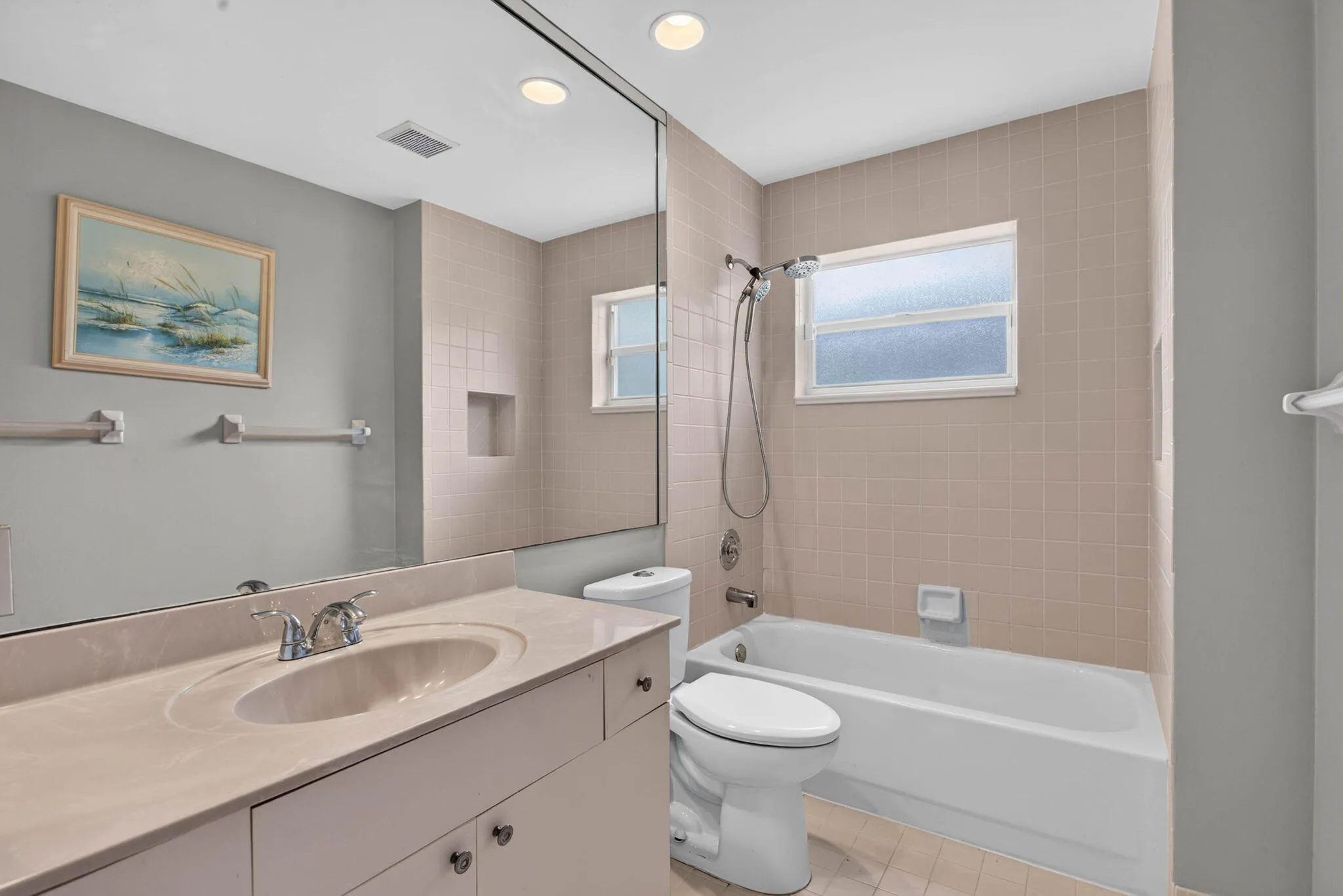 Third bathroom looking from entry door toward shower.