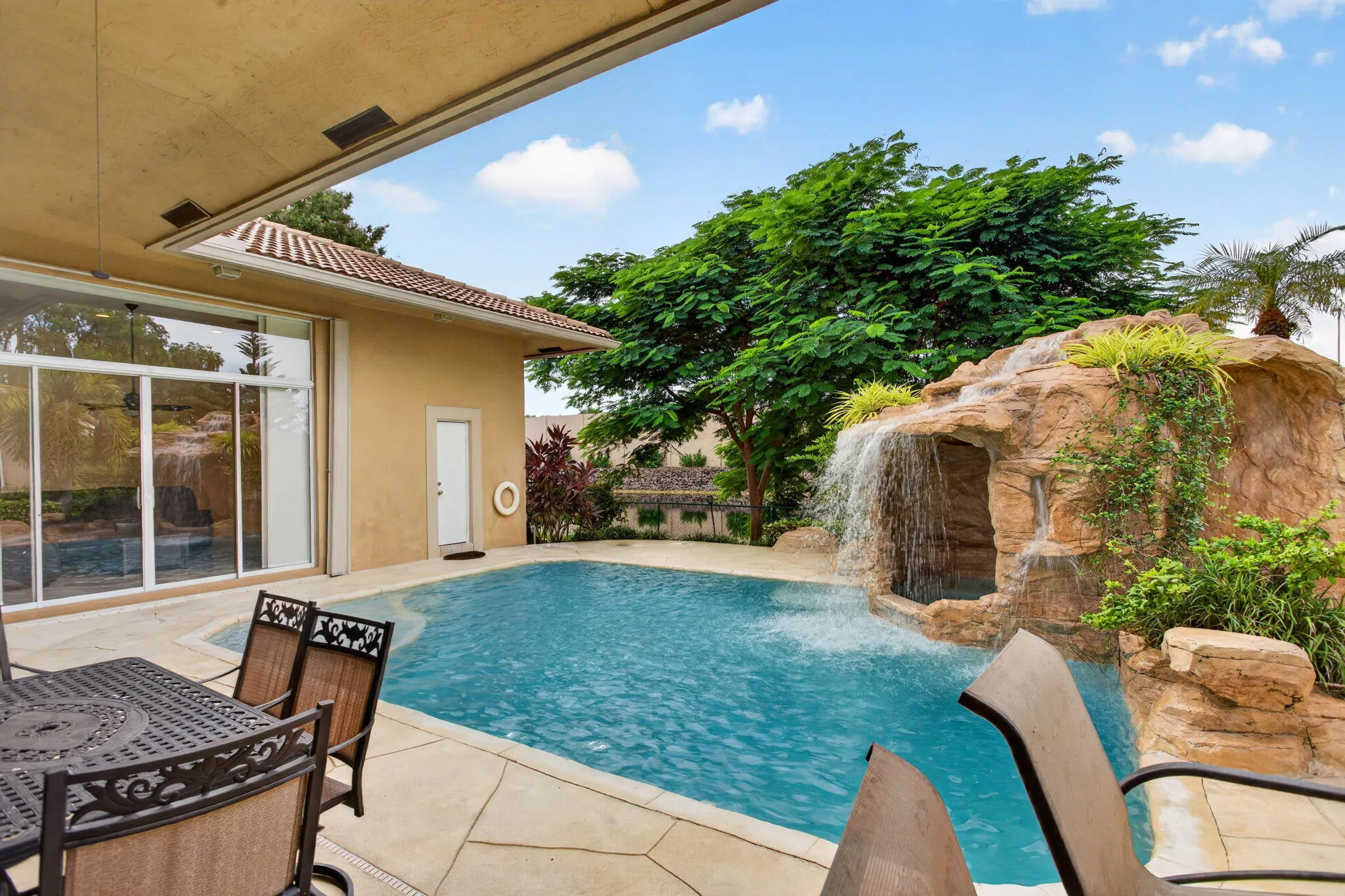Pool deck. View looking from Main bedroom sliding doors towards fifth bedroom cabana bath door.