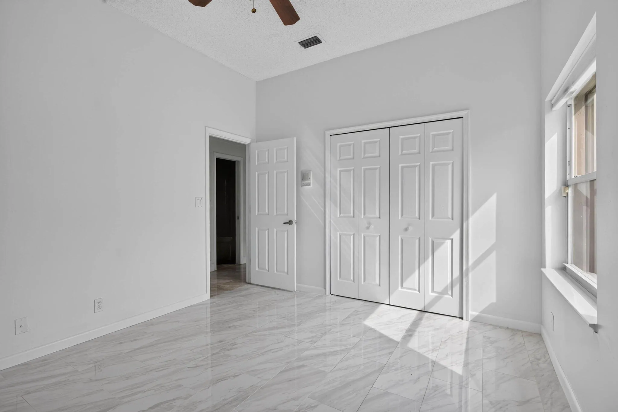 Third bedroom. View looking toward entry door and closet.