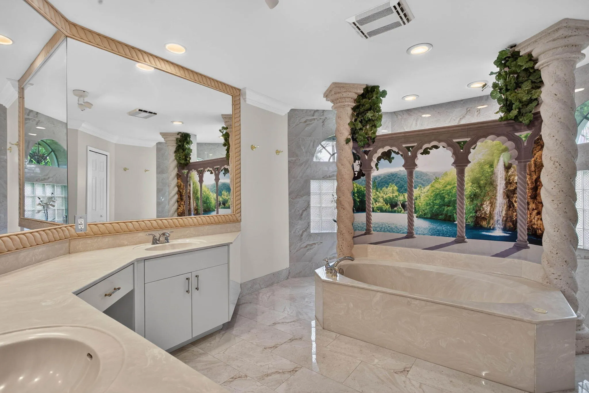 Main room Bath. View from room entrance looking towards the jacuzzi tub and mural'