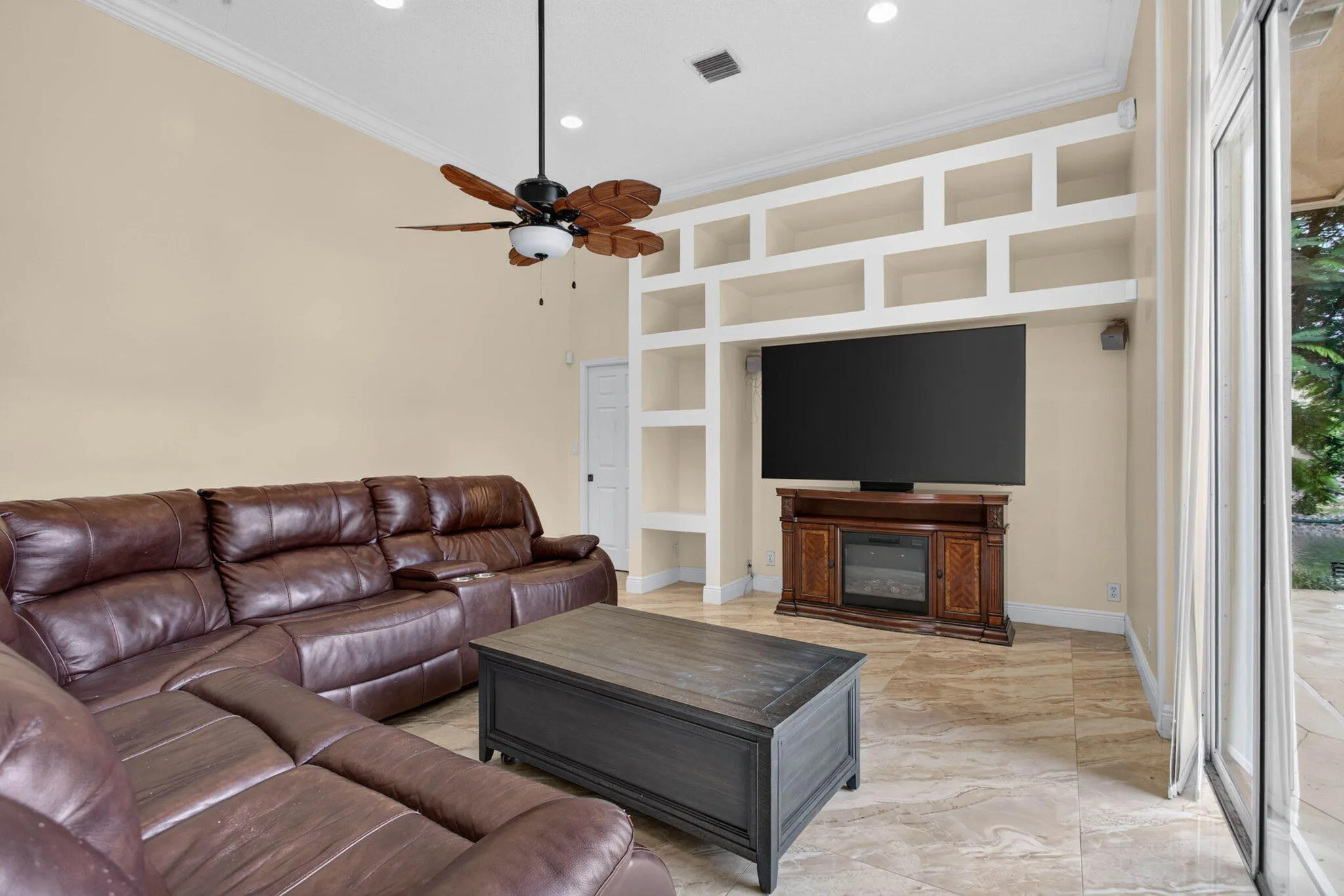 Livingroom. View from Breakfast nook area towards the built in shelving and fifth bedroom entrance.