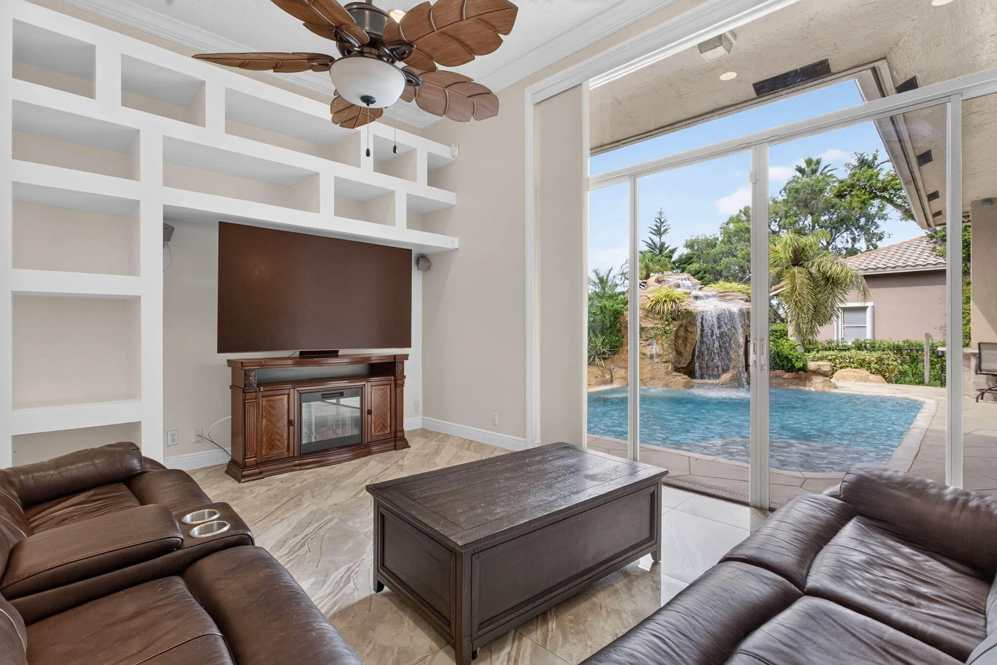 Livingroom. View from fourth bedroom entrance towards the pool deck sliders.
