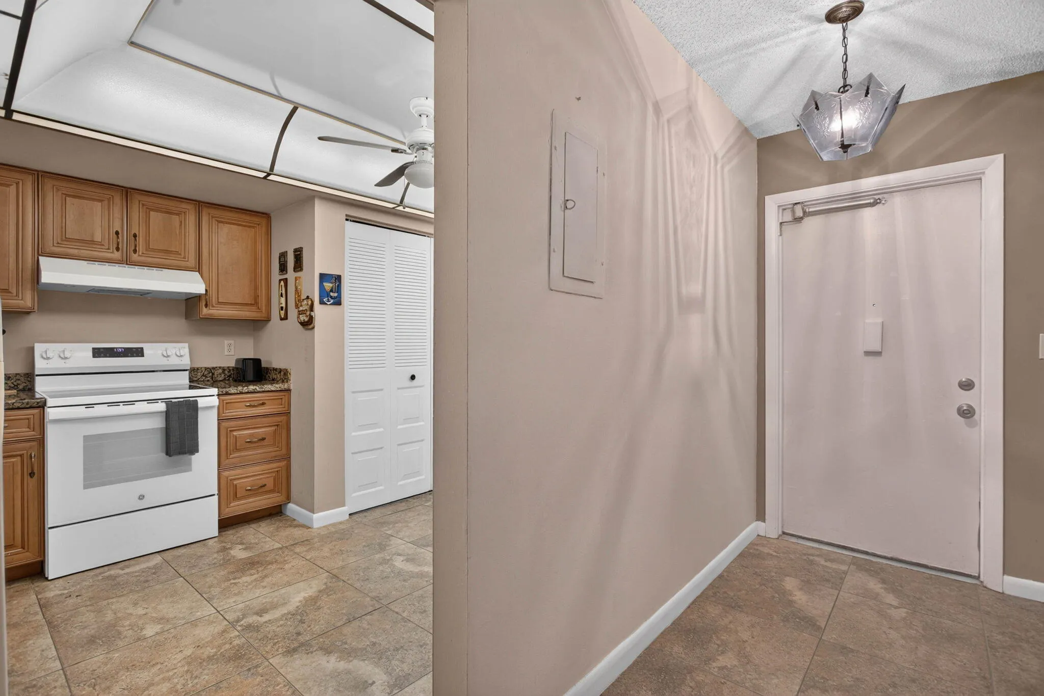 ENRY FOYER AND KITCHEN