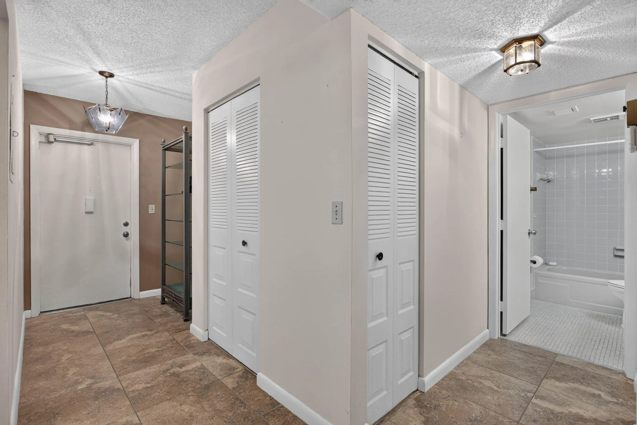 ENTRY FOYER HALL TO FULL GUEST BATH