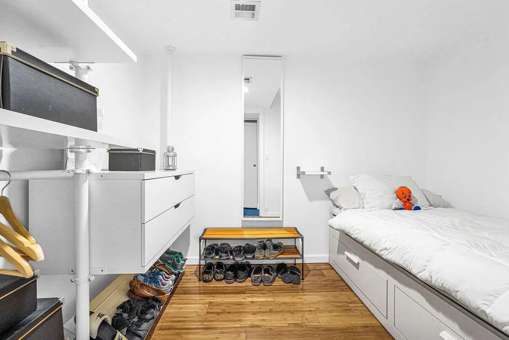 Oversized primary bedroom closet with built in spare bed.