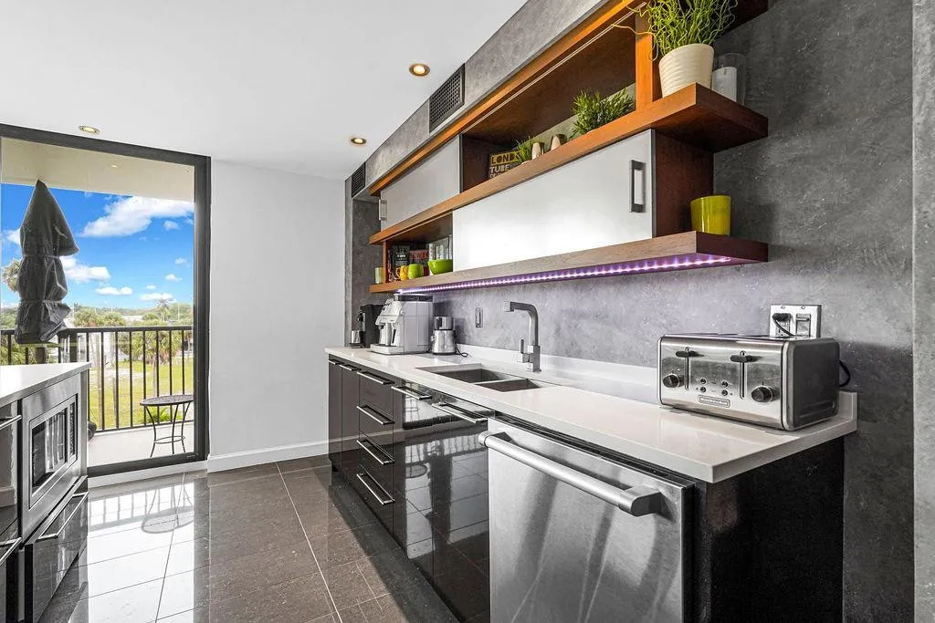 Sliding glass doors going out to the balcony from kitchen & living room.
