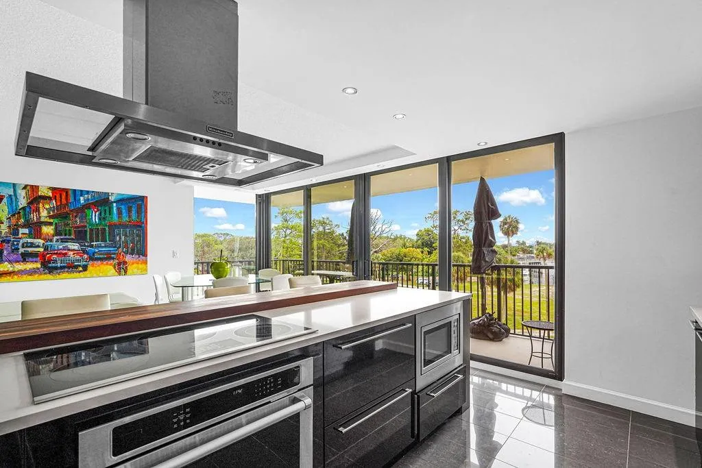 Kitchen with SS cooktop, undercounter oven, microwave & hood