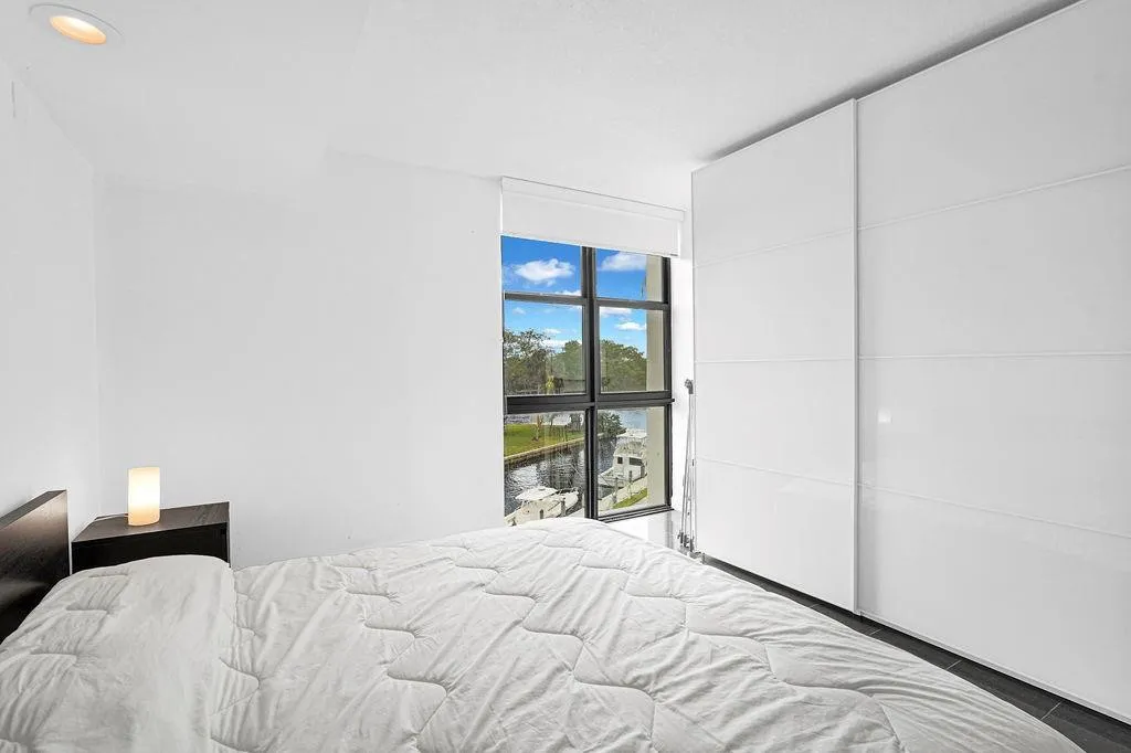 Primary Bedroom with view of boats on canal