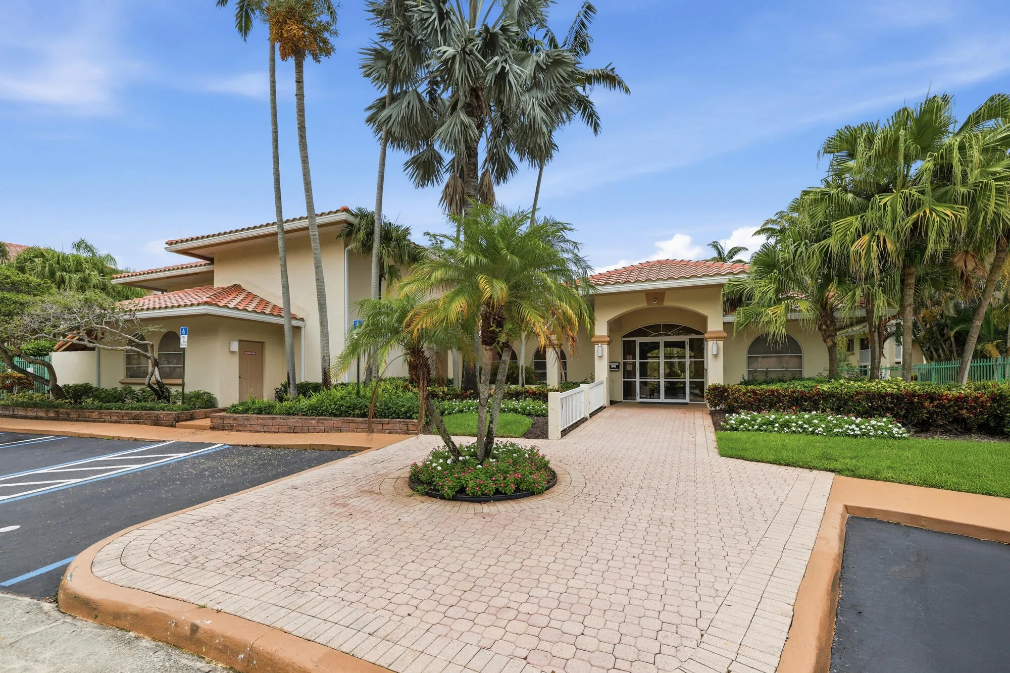 Mediterranean-style building with a terracotta tile roof and stucco exterior