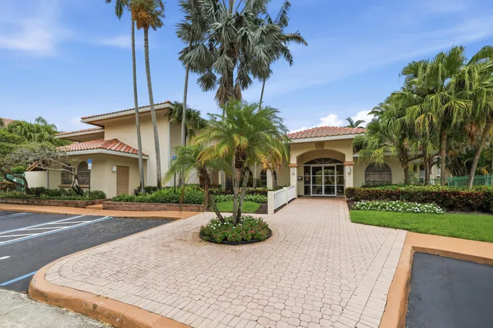 Mediterranean-style building with a terracotta tile roof and stucco exterior