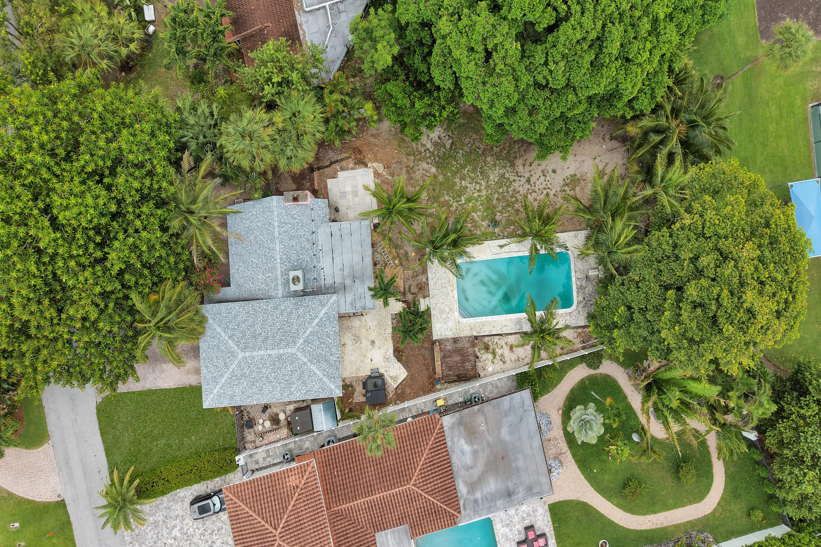 Bird's eye view: residence, full-size pool, and open yard on the 80' x 180' parcel