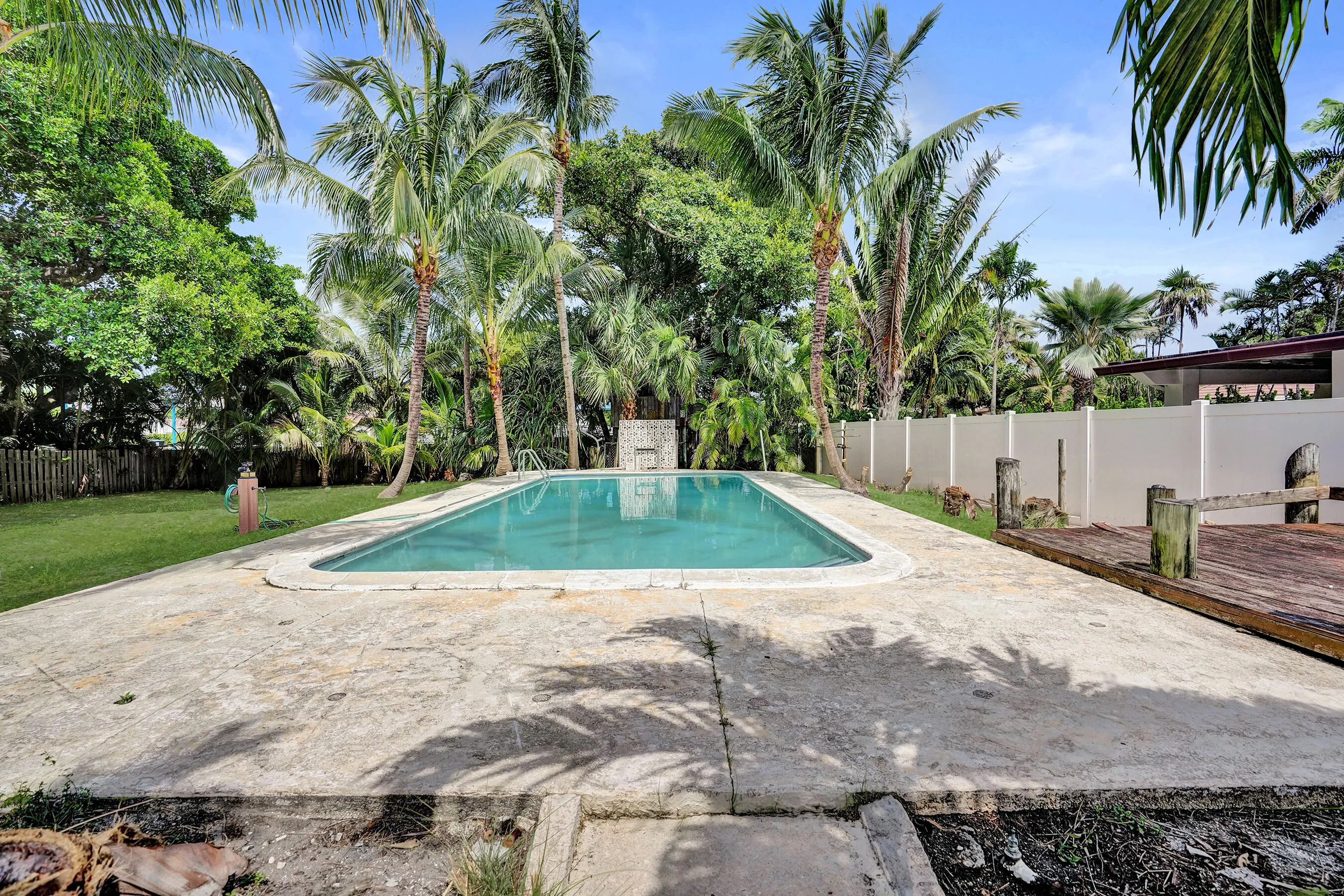 Full-size pool anchors the expansive backyard, rare space for the island