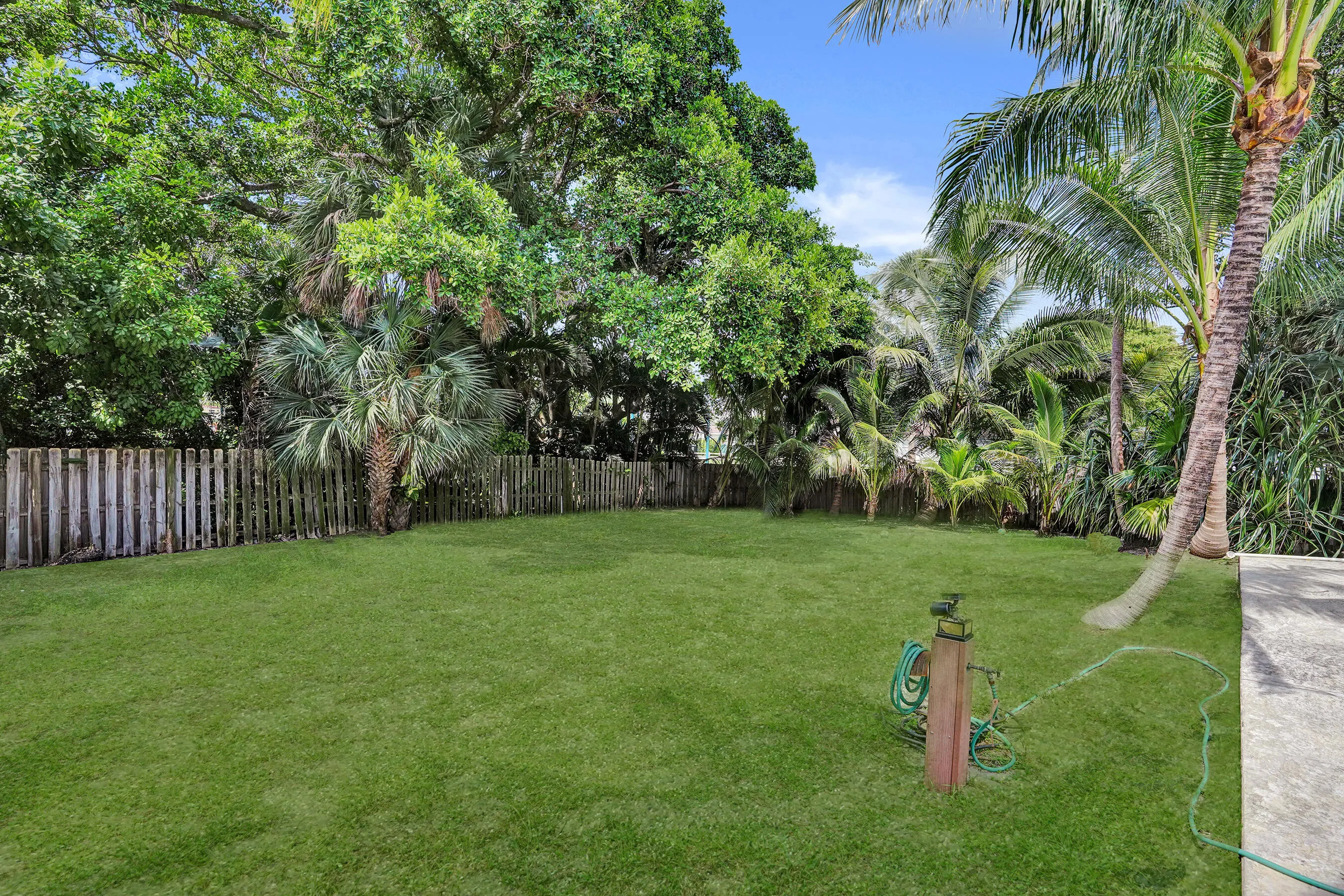 A true backyard on the island, fully fenced with room to design your vision