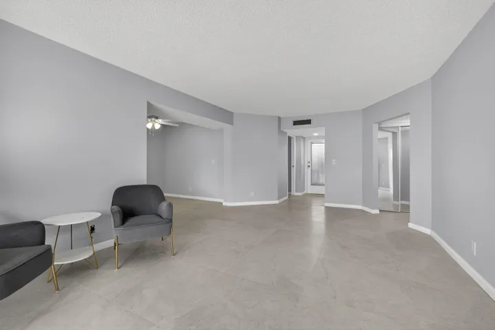 View of living room and dining room area from balcony