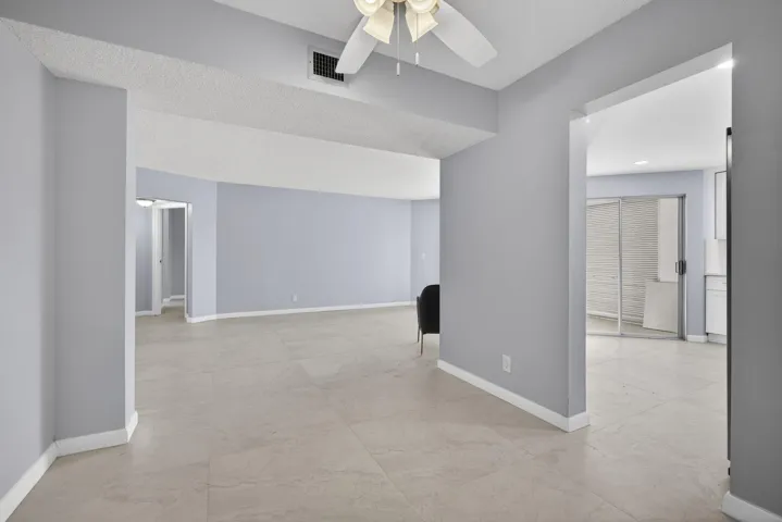 View from dining room area of kitchen and living room