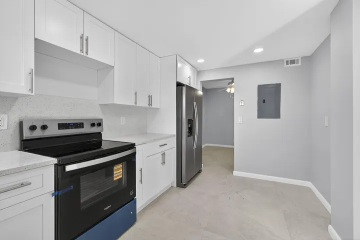 View of kitchen showing new electrical panel