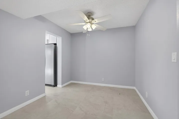 View of dining room area with new ceiling fan