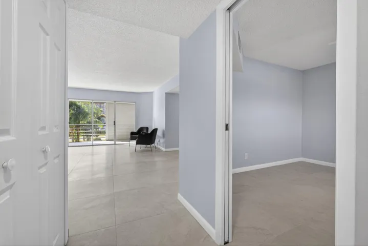View of guest bedroom and living area from entry door