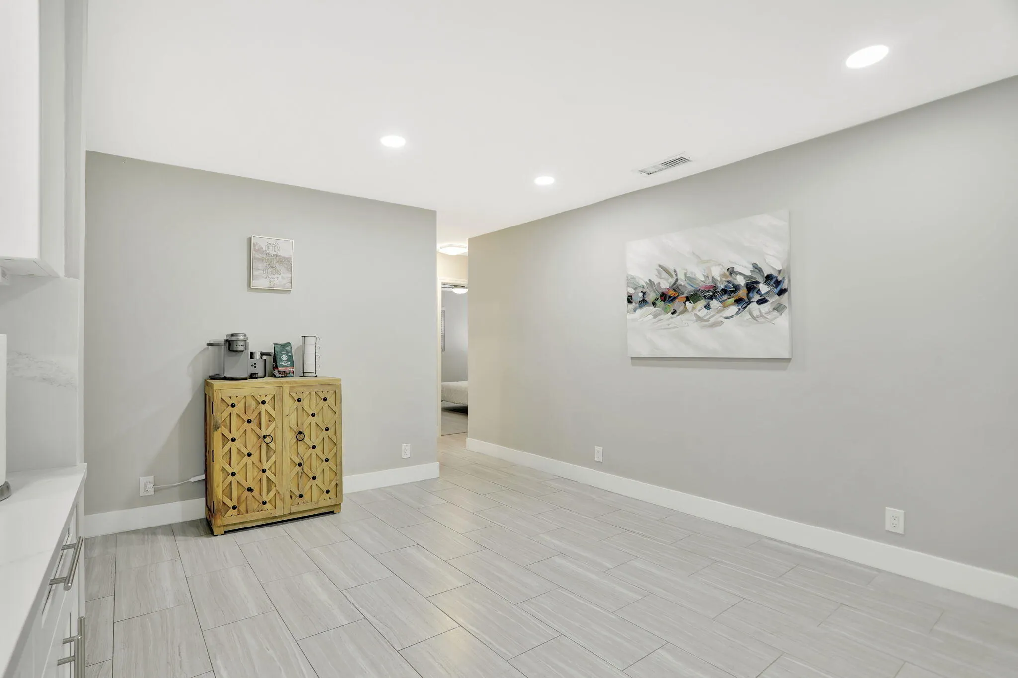 Versatile flex space off the kitchen—ideal for a home office, reading area or additional gathering space