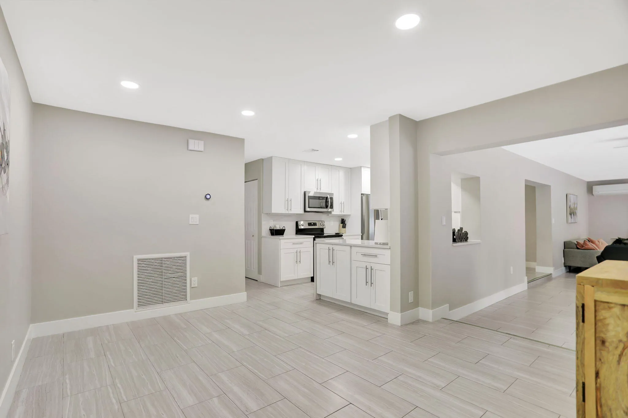 Versatile flex space off the kitchen—ideal for a home office, reading area or additional gathering space