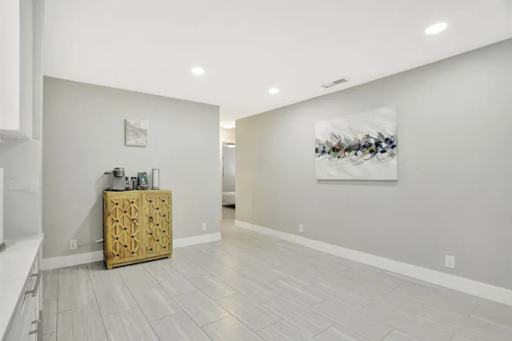 Versatile flex space off the kitchen—ideal for a home office, reading area or additional gathering space
